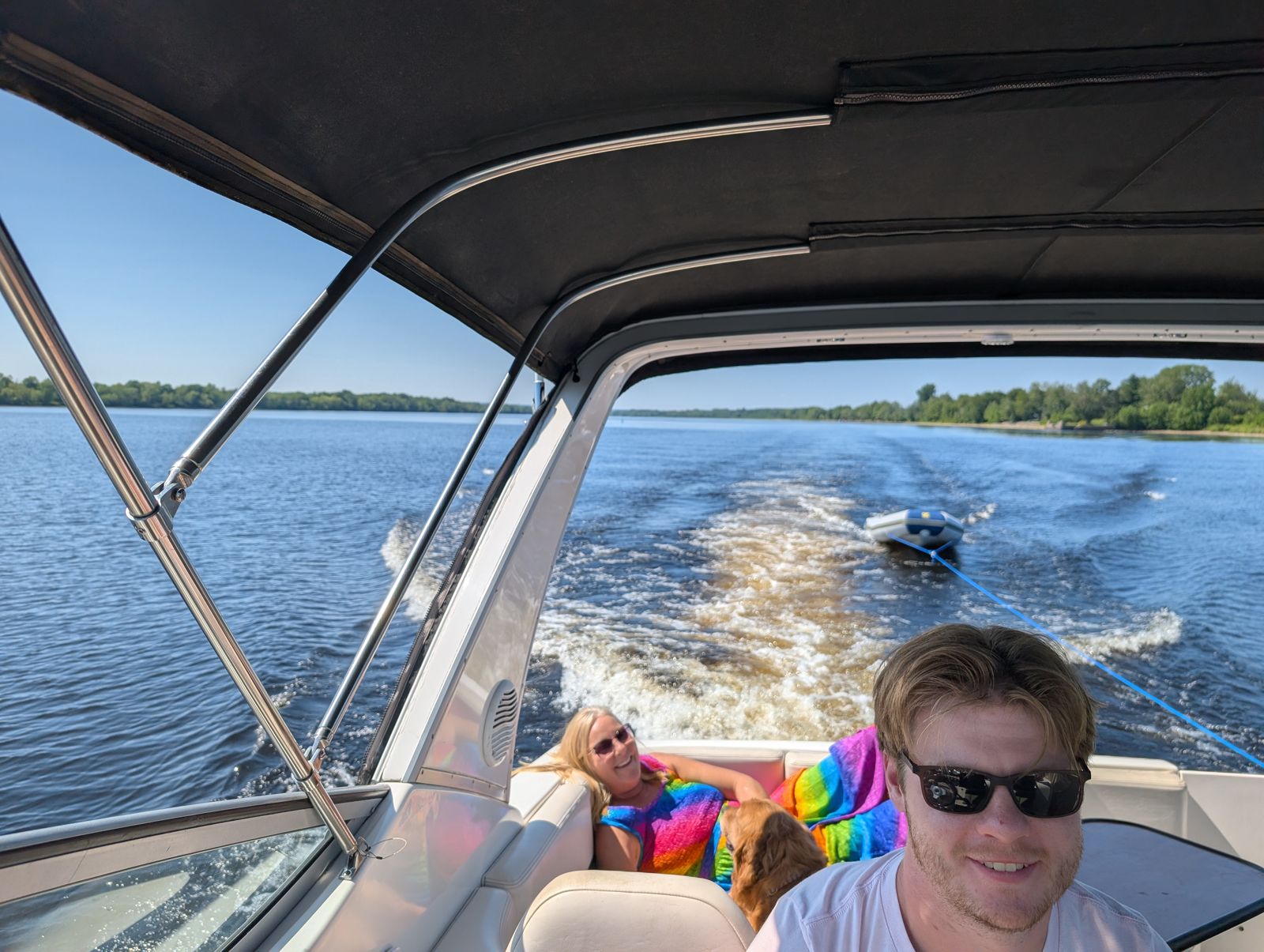 Nicholas at the helm of Island Belle with Tanya and Clancy behind and the Zodiac in tow
